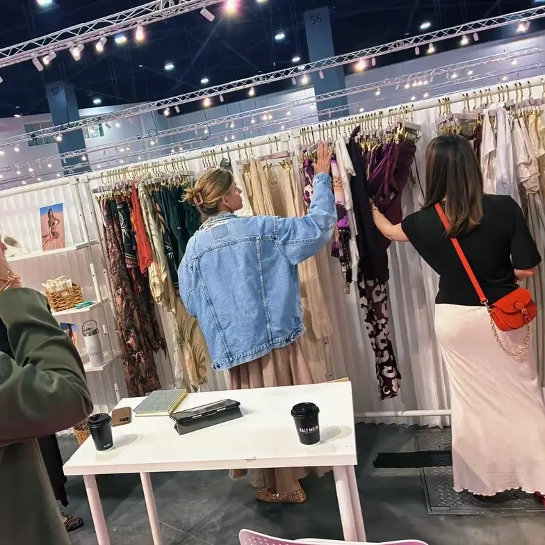 Premium multi-brand swimwear showroom setup by TS Sales Group, presenting luxury wholesale resortwear collections to North American retail buyers.