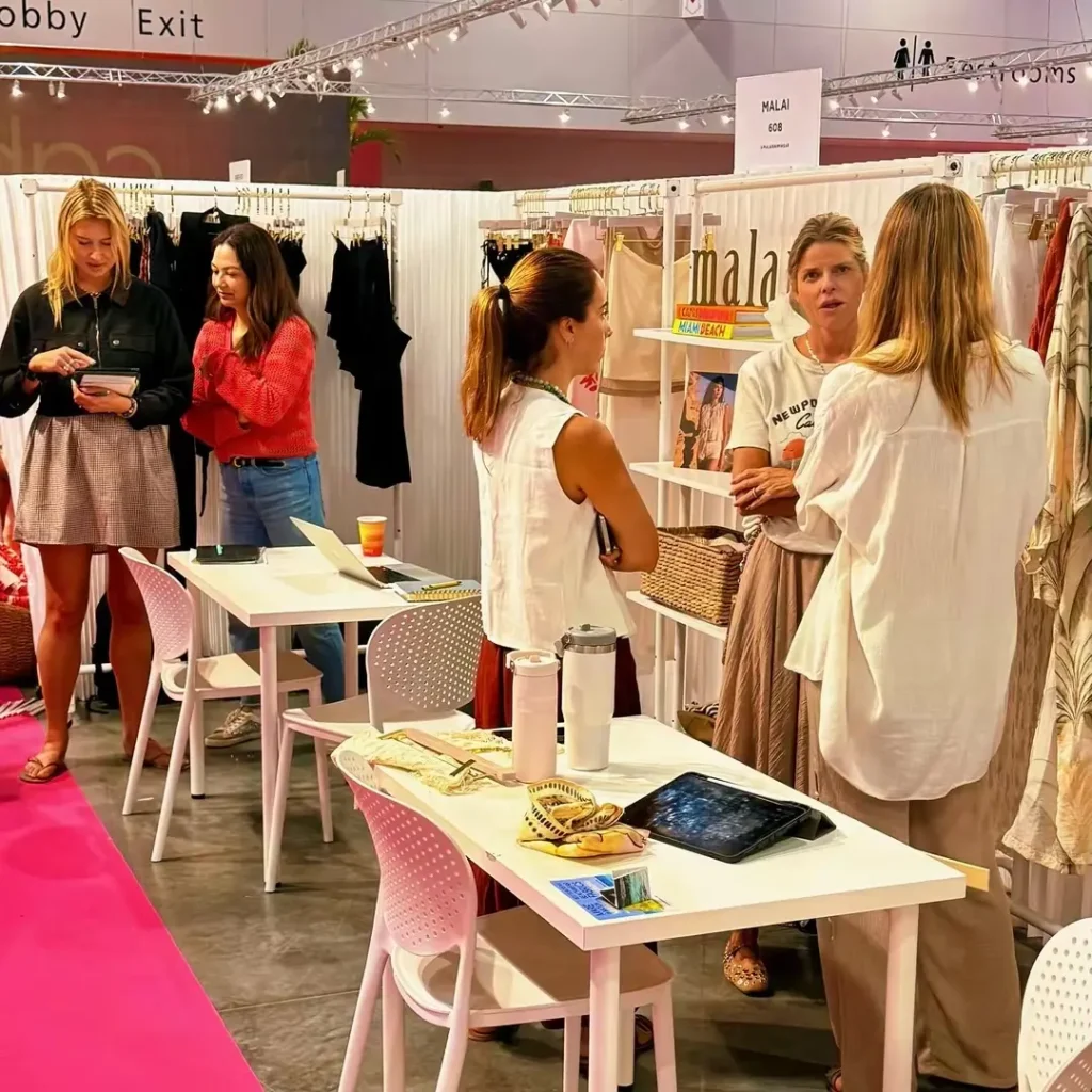 Premium multi-brand swimwear showroom setup by TS Sales Group, presenting luxury wholesale resortwear collections to North American retail buyers.